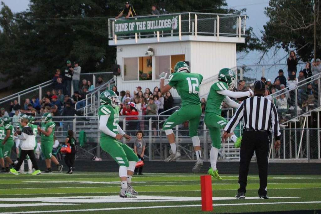 Football players celebrating a touchdown