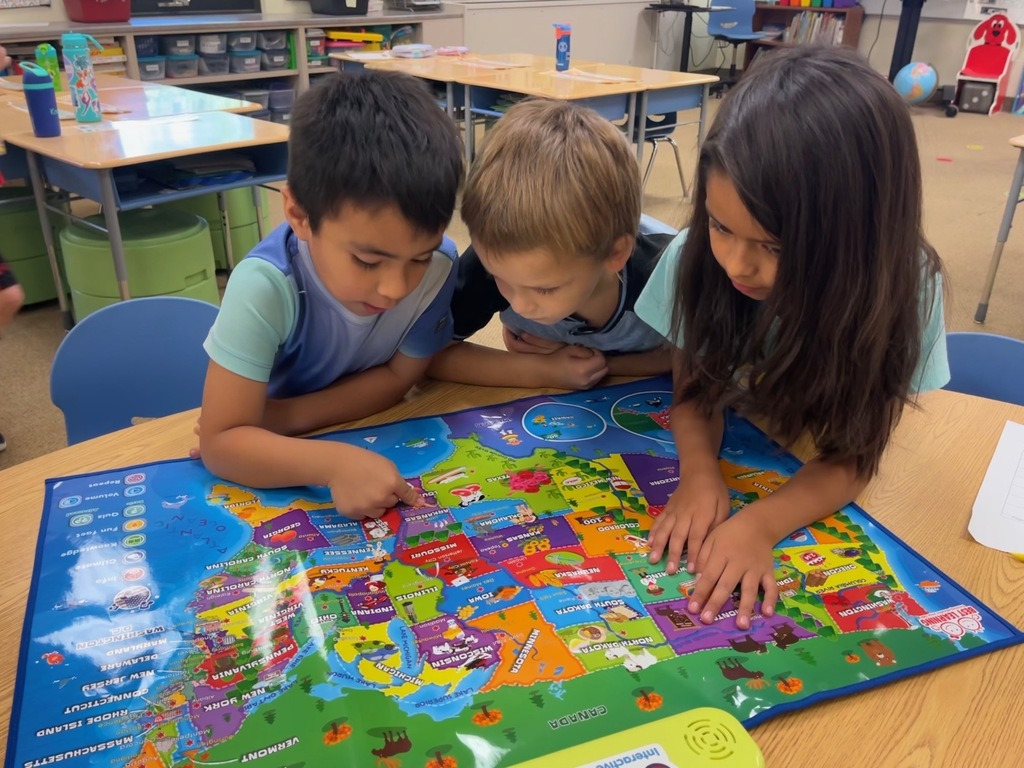 kids studying the map