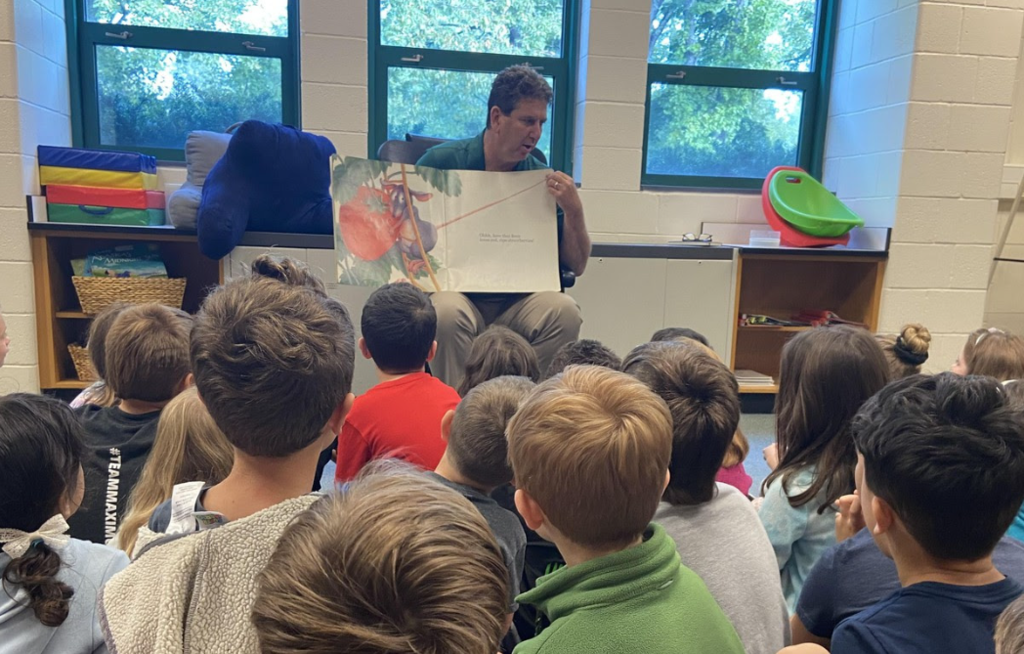 superintendent reading to students