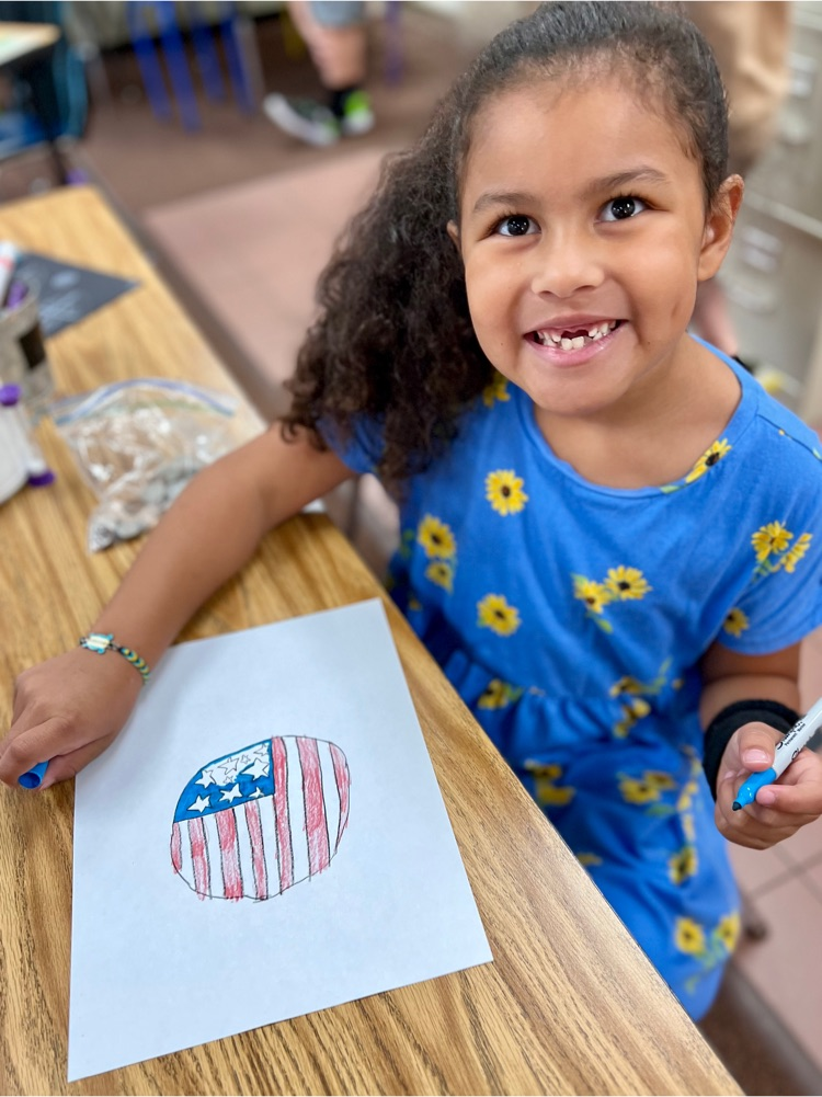Student drawing a flag Dot