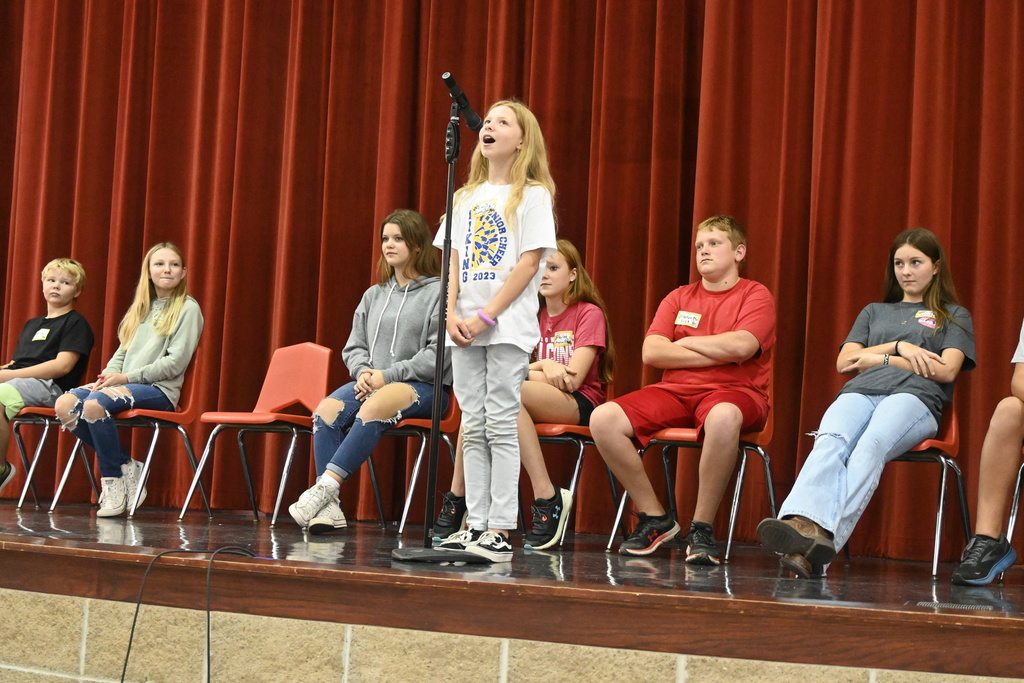 Emily Gage, a fifth grader from Guthrideg, spells a word.