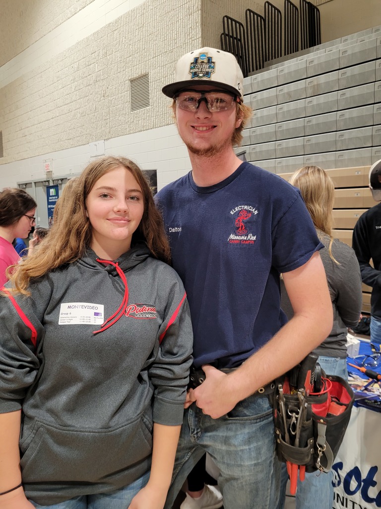 Brooklynn Pederson visiting with her MHS grad brother, Dalton 