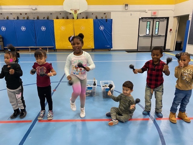 students playing maracas