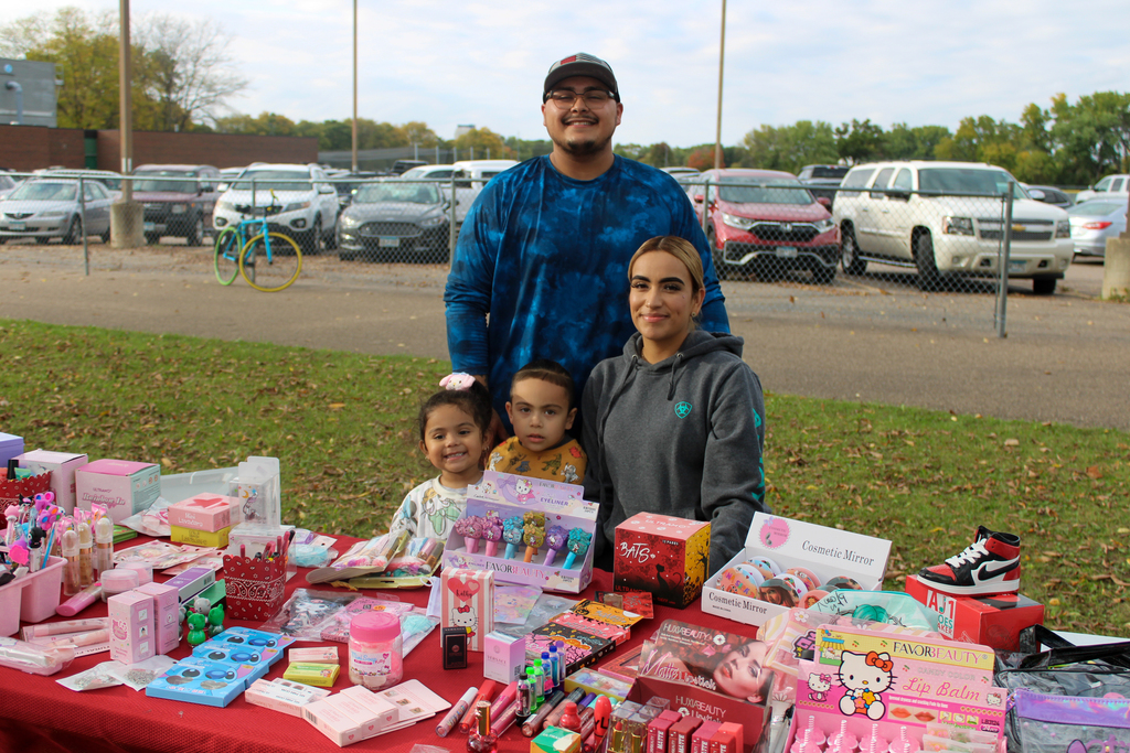 A family representing their business including goods and mexican lemonade.