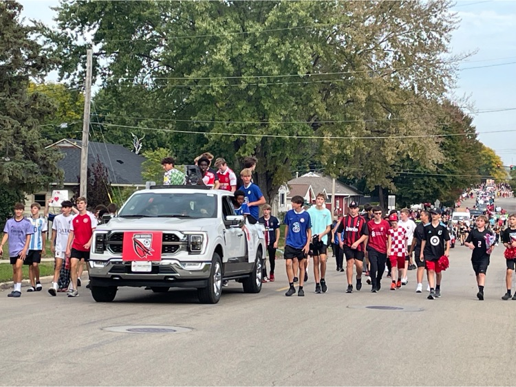 Another fun float with soccer student athletes walking next to it