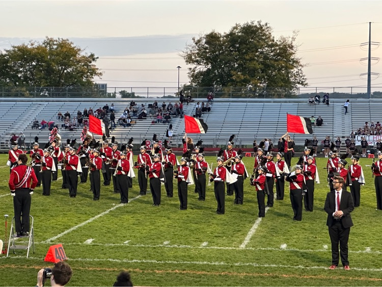 JM Marching band and Color Guard play on the field