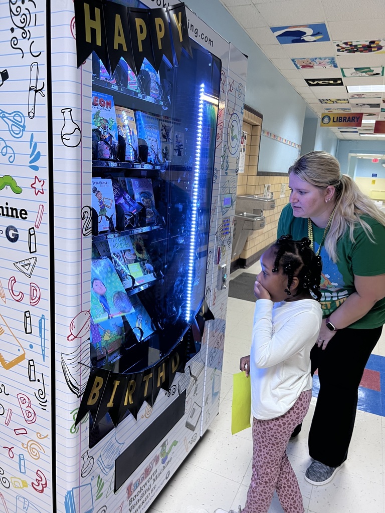 First grader gasps with awe as her book falls.
