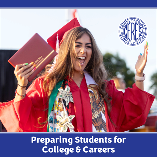 Excited graduate in red cap and gown holds up diploma