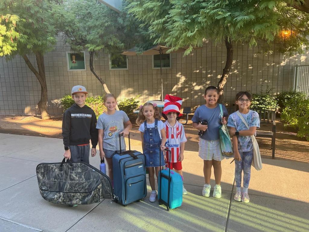 several students with different kinds of bags