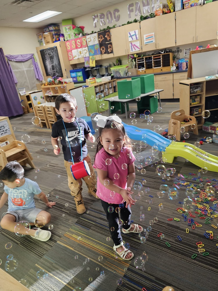 students playing with bubbles