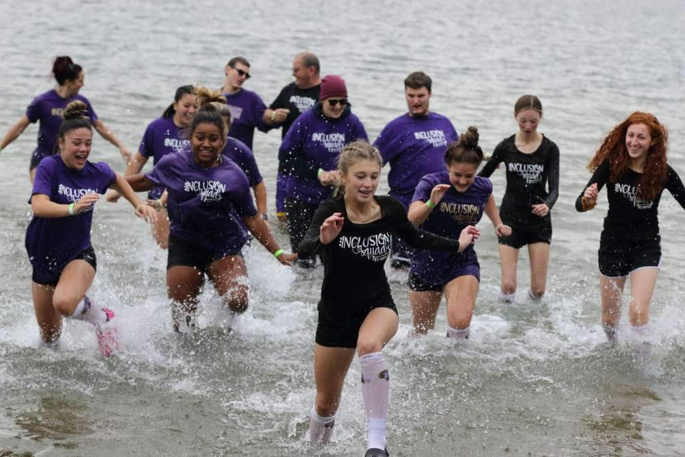 Students running in water