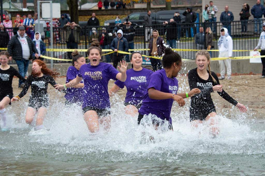 Students running in water
