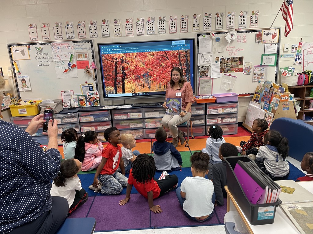 volunteer reading to prek class