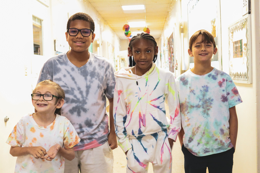 4 students smiling