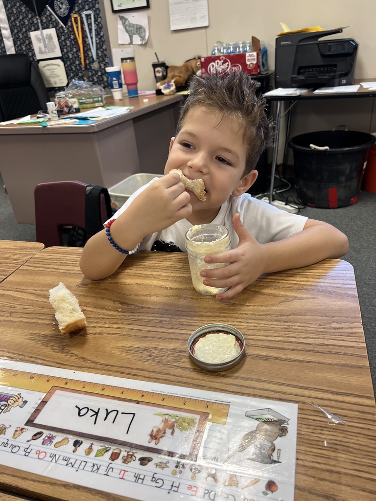 a boy eating bread and butter