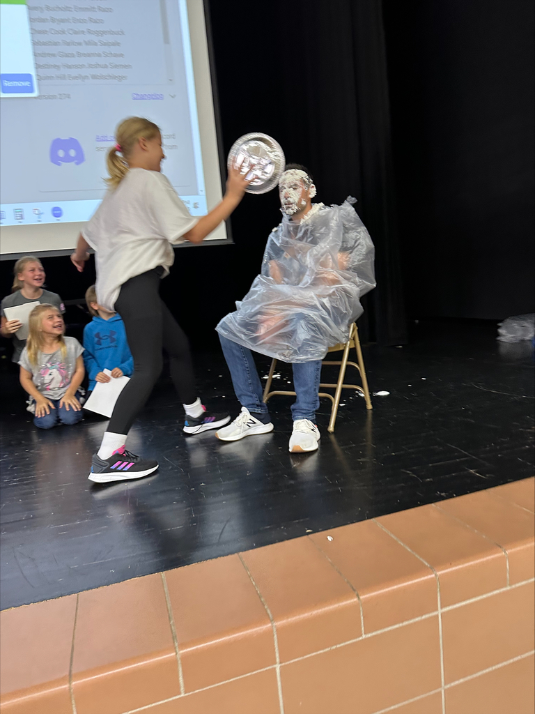 Principal Quintano getting pied in the face by a 5th grade student for the class having positive behavior for the month of September. 