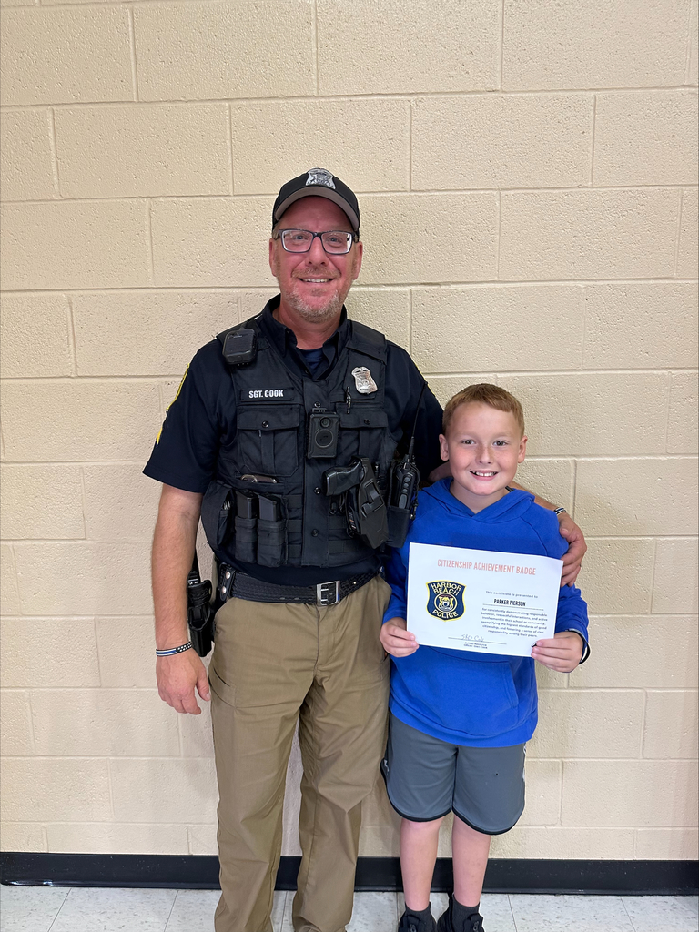 School Resource Office: Glen Cook awarded Parker Pierson with the first Citizenship Achievement Badge for  demonstrating positive behavior. 