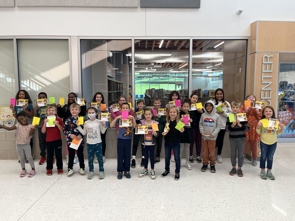 Students K-5th grade showing their paws and certificates to Texas Roadhouse.