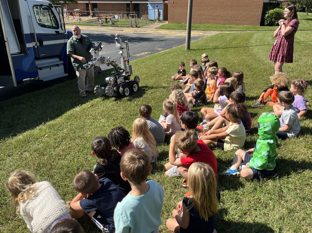 Children see a demonstration on a police robot.