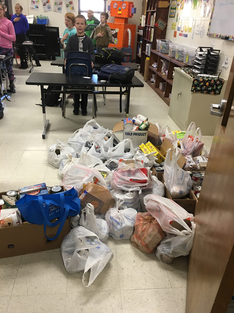 5th graders bring goods for the Jr. Beta food drive.