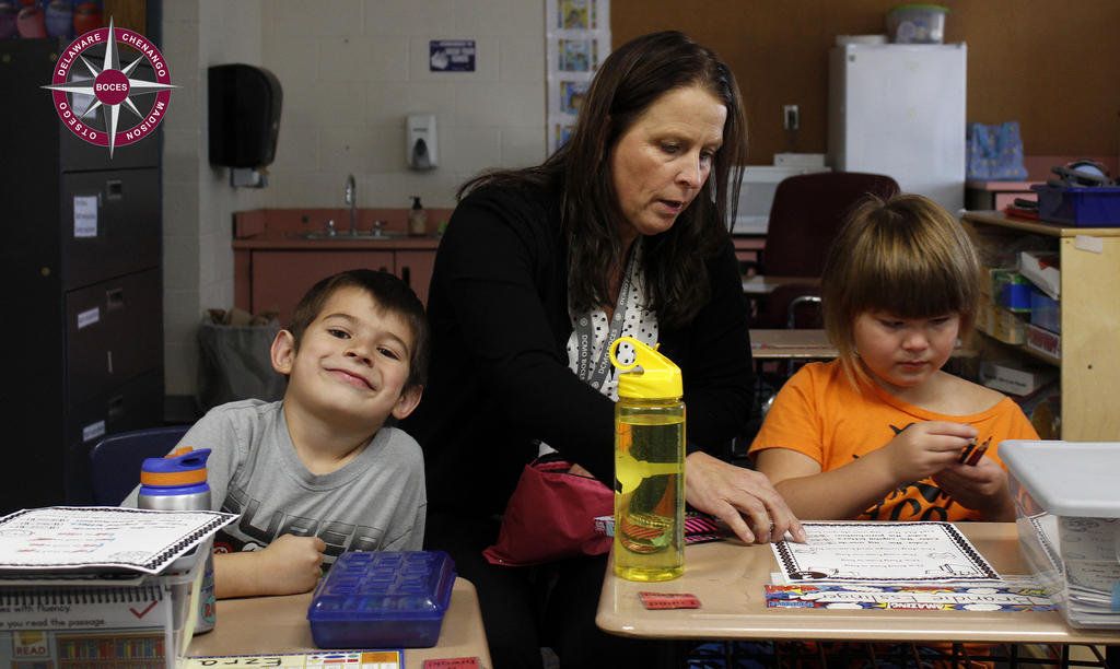 Director of Special Education sara Stafford works with students in their new classroom.