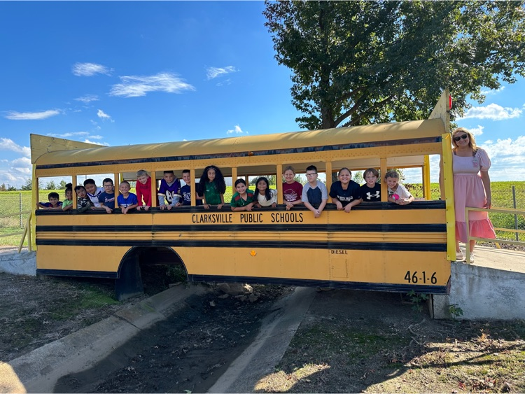 students by a bus