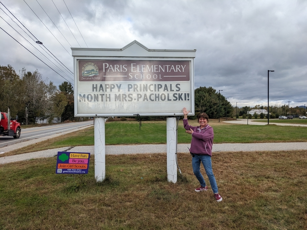 Mrs. Pacholski with her school sign celebration.