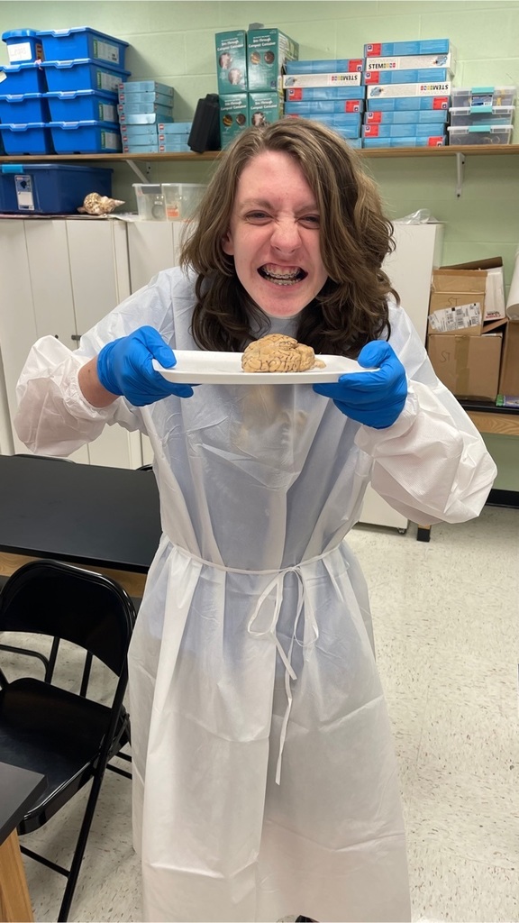 student holding brain