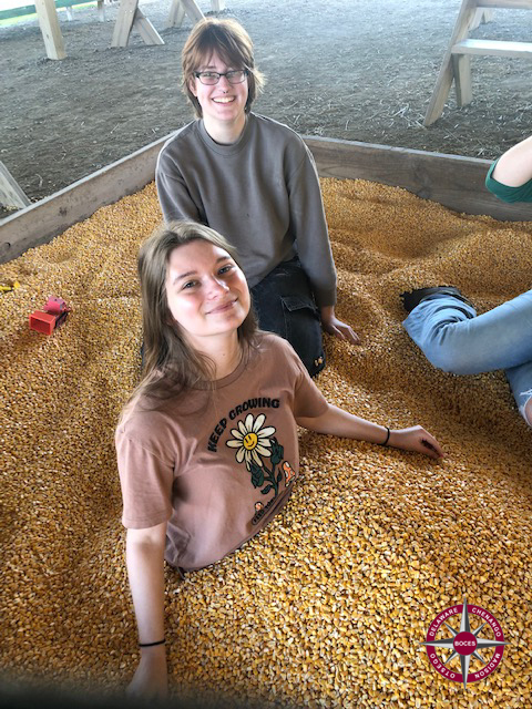 students play in corn