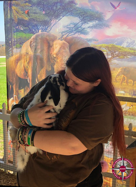 student holds a bunny