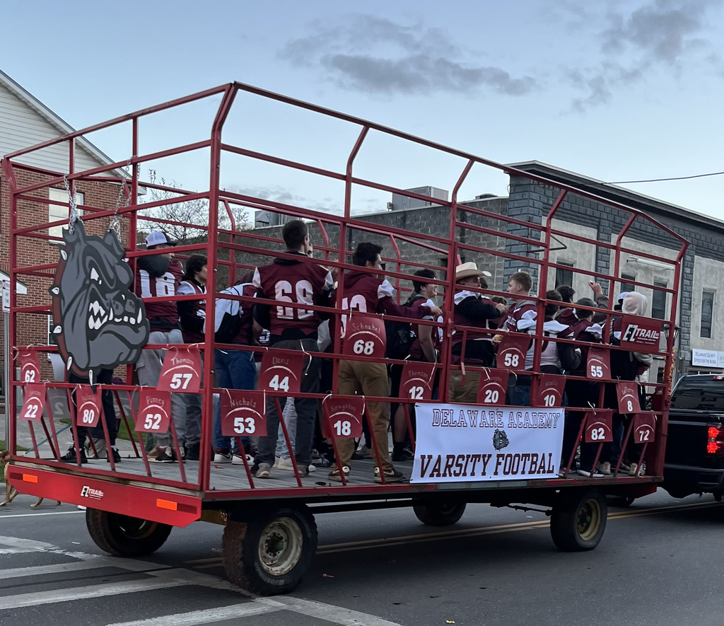 varsity football team on hay wagon