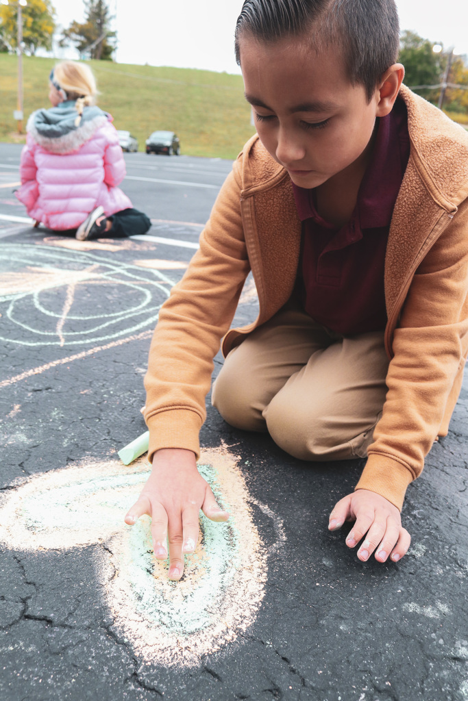 student chalking