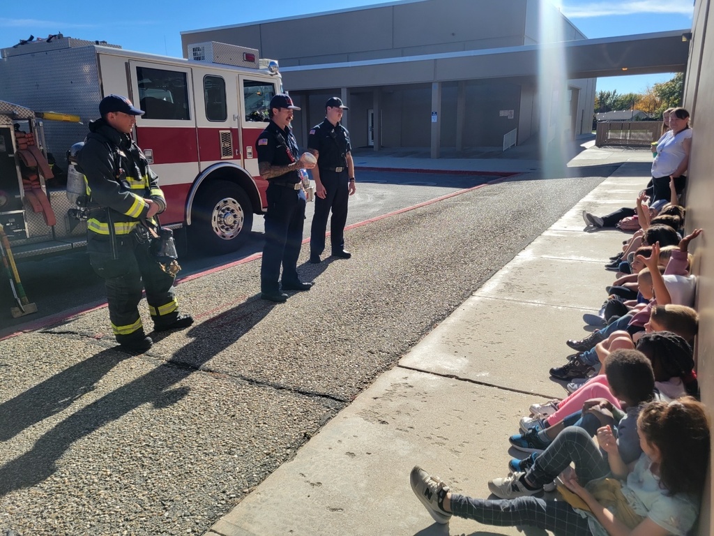 Frist graders with Boise Fire Department during a fire safety presentation