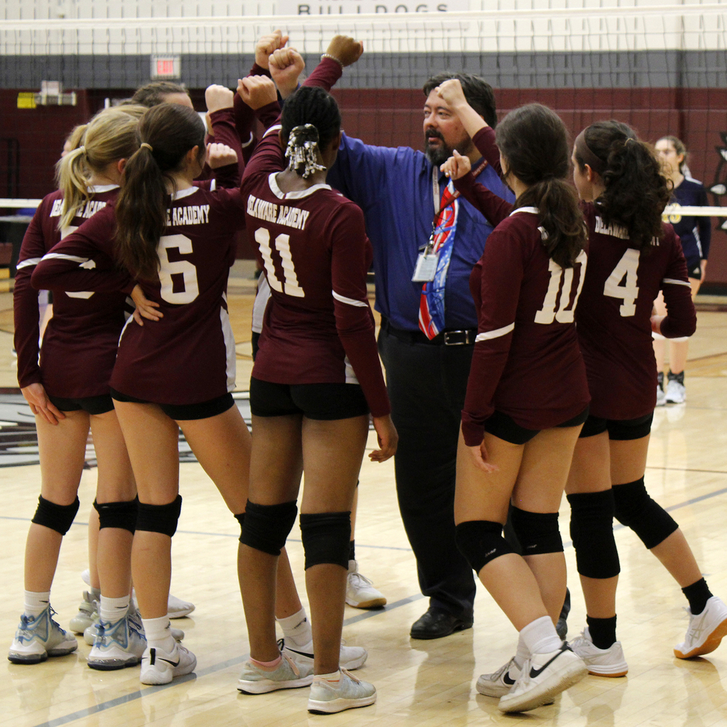 volleyball team with coach