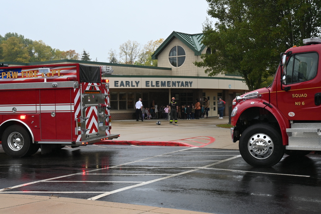 fire trucks with students and elementary school