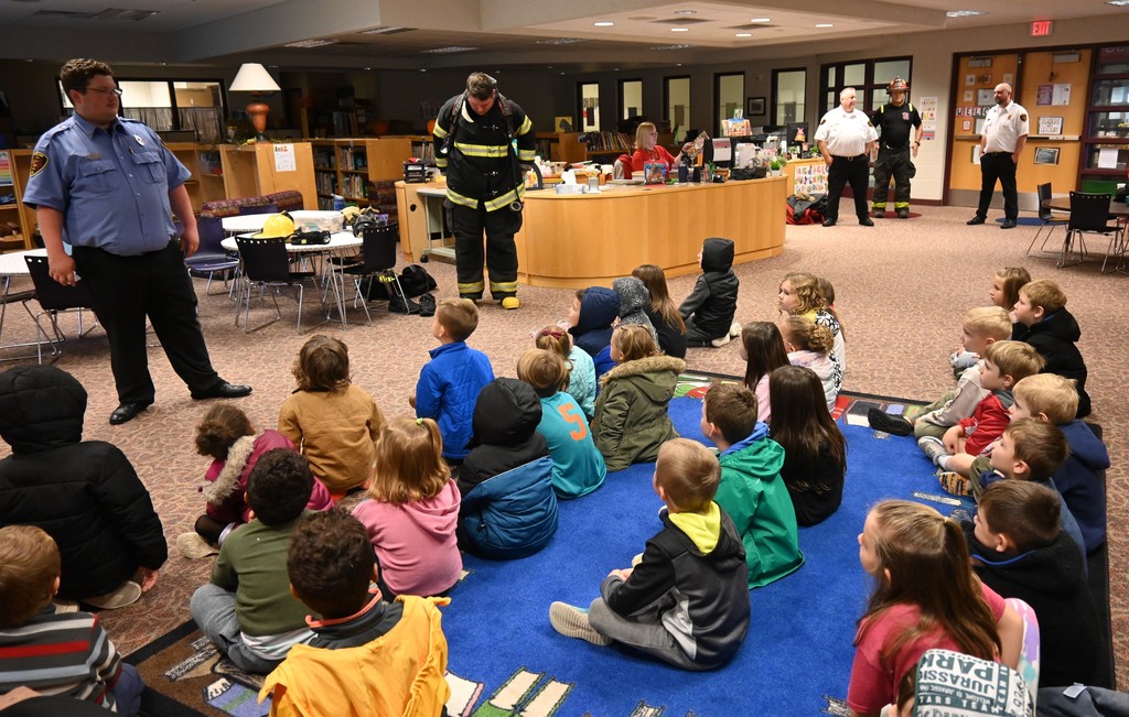 fireman giving presentation to elementary students