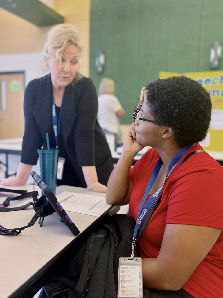 two teachers talking with each other