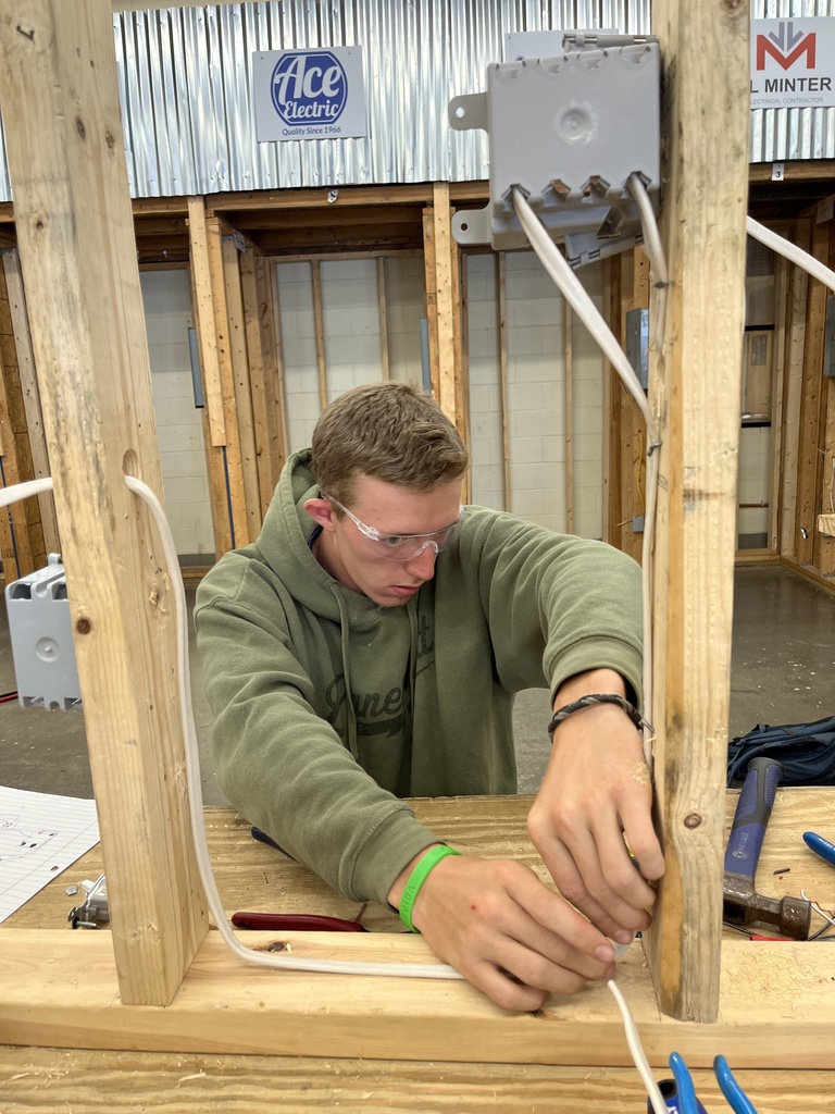 Two students work on an Electricity 2 assignment.