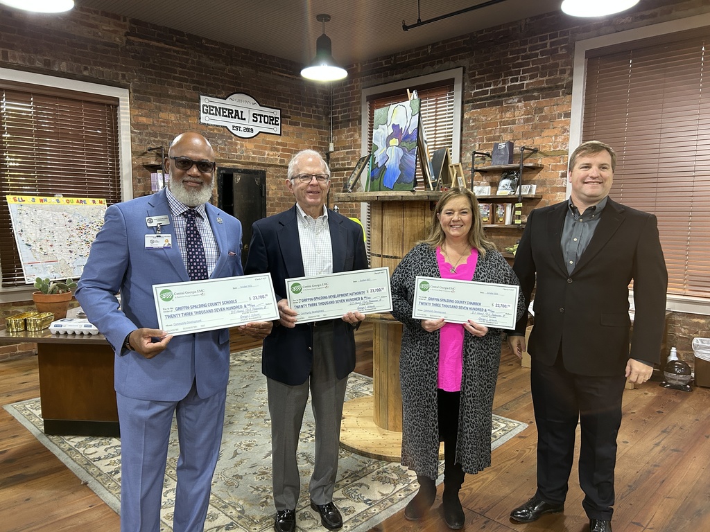 posing with large check