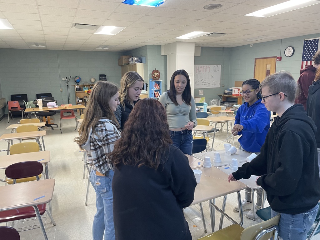 Six high school students participating in a team building activity.