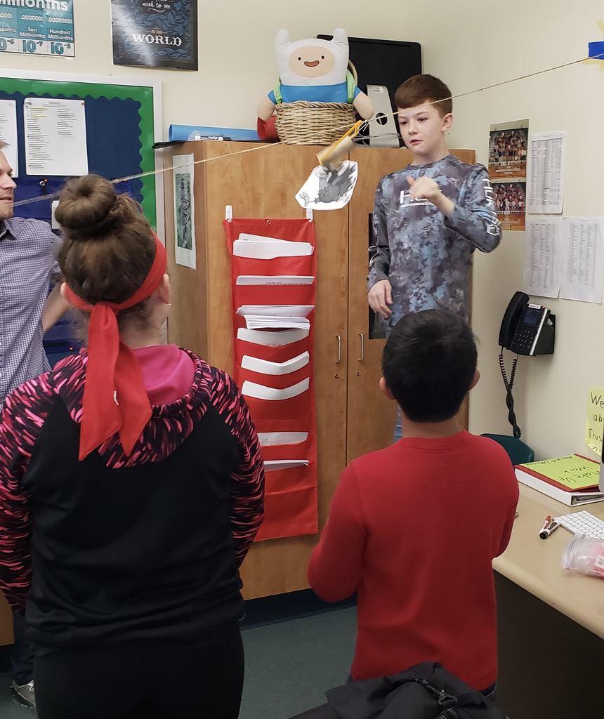 A group of students making a turkey transporter