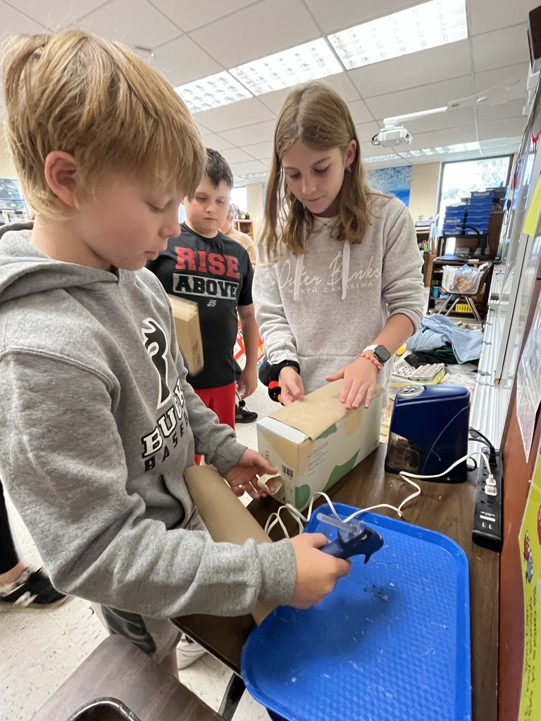 Students make models of Native Virginia homes.