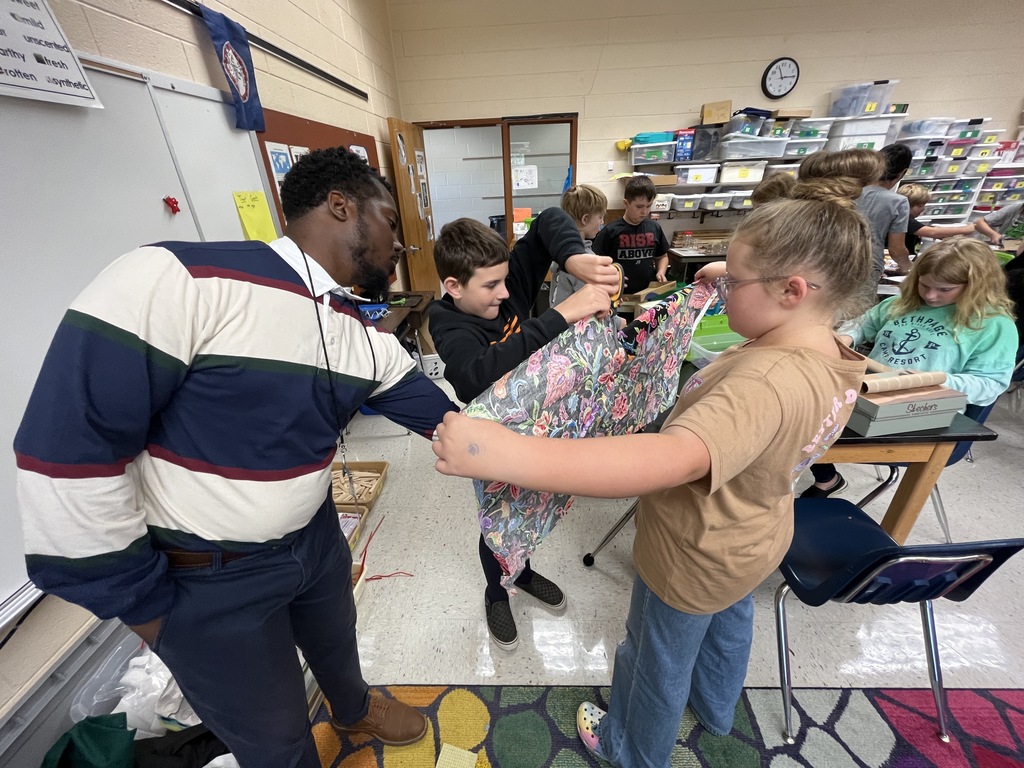 Students make models of Native Virginia homes.