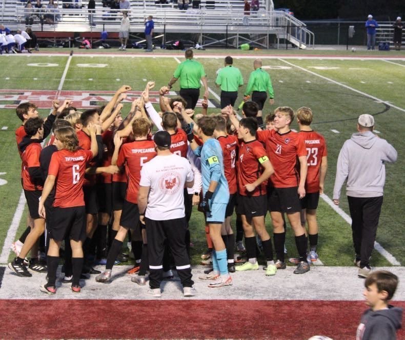 THS soccer team in a huddle. 