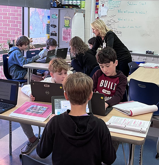 Students work on the second practice problem for Future Problem Solving.