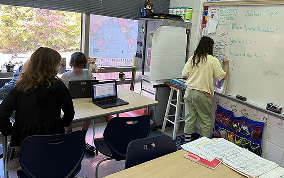Students work on the second practice problem for Future Problem Solving.