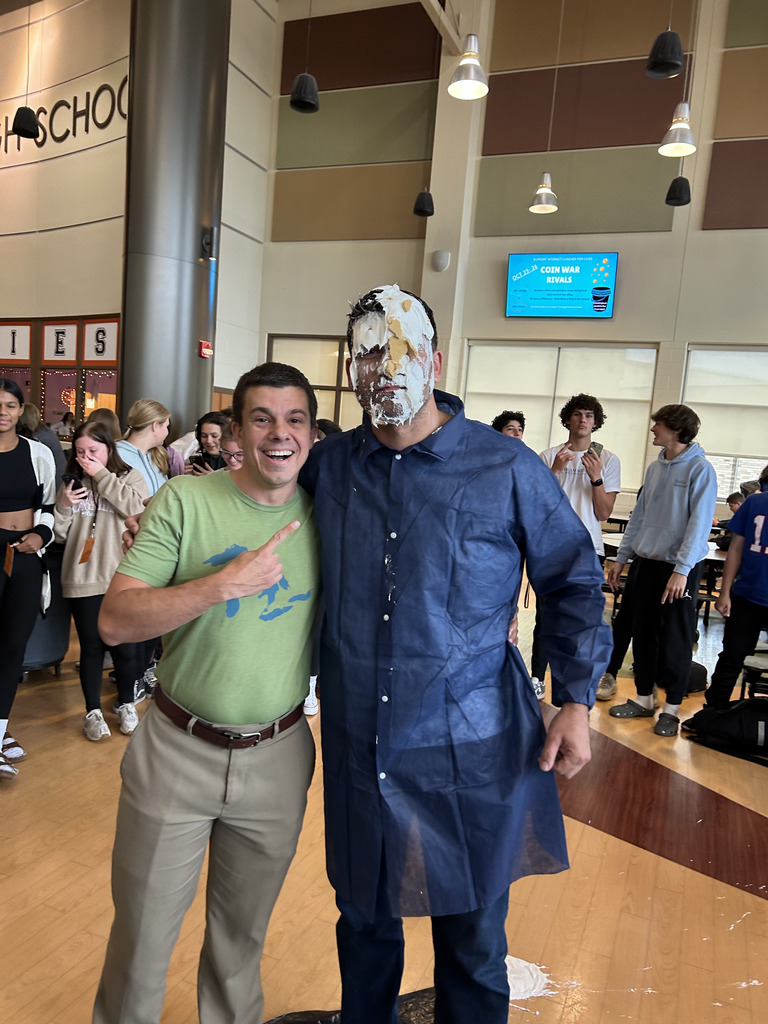 2 men one with pie on his face