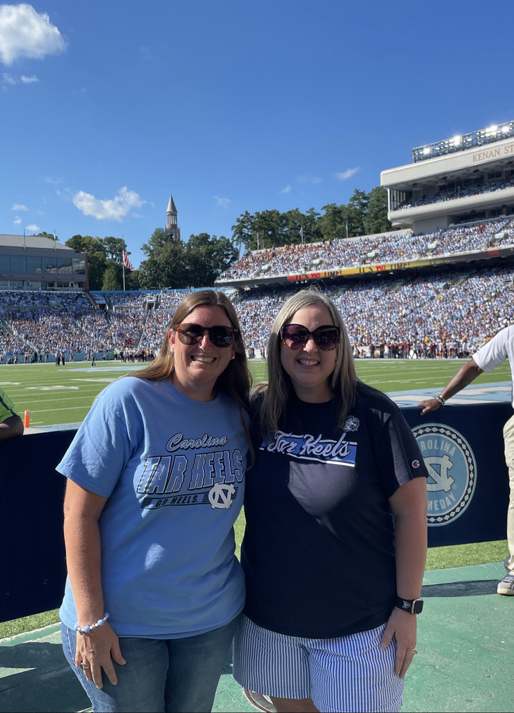 two teachers at football game