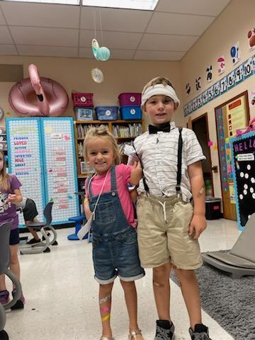 Two students celebrate Nursery Rhyme Day.