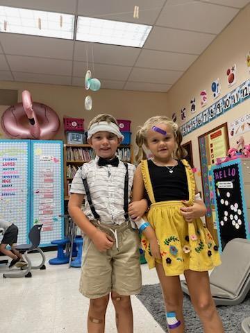 Two students celebrate Nursery Rhyme Day.